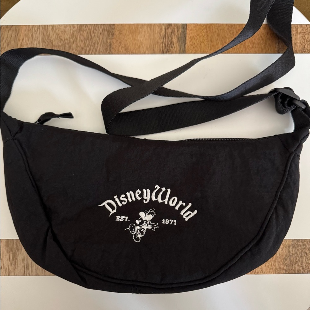 Black crescent crossbody. Embroidered with Disney World.